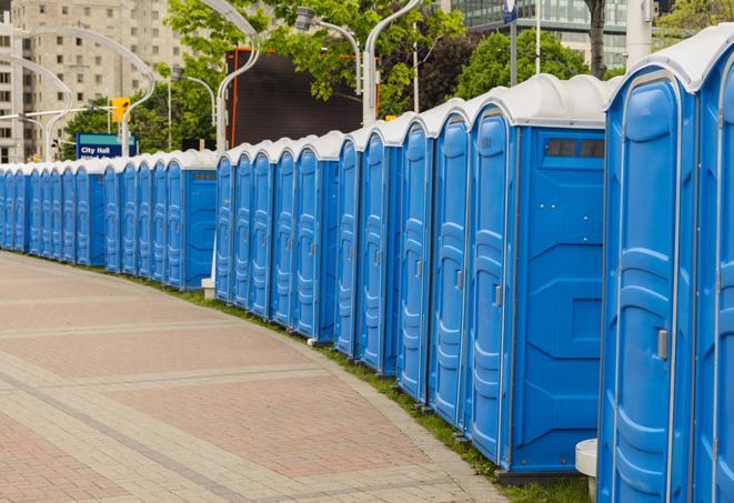 a row of sleek and modern portable restrooms at a special outdoor event in Appling